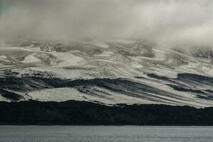 Deception Island, Antarctic mountainous landscape, Antarctic Peninsula photo