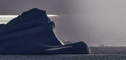 Tempano floating in the Antarctic Sea, near the Antarctic Peninsula. photo