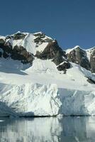 Glaciers and mountains in Paradise bay, Antarctic peninsula, Antartica.. photo