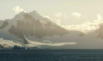 Tempano floating in the Antarctic Sea, near the Antarctic Peninsula. photo