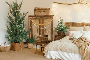 Cozy interior decorated for Christmas in Scandinavian style. Live fir trees decorated with natural ornaments made of dried oranges photo