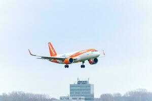 Airplane from EasyJet landing at Schiphol AirPort. Amsterdam Netherlands April 15 2023. photo