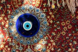 The Blue Turkish Evil Eye Nazar Amulet or Nazar Boncugu blue sapphire charm souvenir from Turkey photo