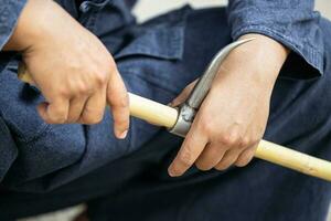 Elephant trainer or Mahout with Bull Hook Ankus tool for control order wild elephant photo