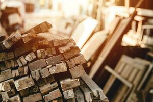 old wood pile in sawmill lumber. wooden pole stacked warehouse stock collection dried photo