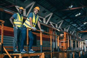 Engineer mechanic team workers standing relax in Diesel Locomotive Repair Shops photo