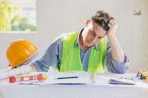 stress problem construction engineer builder architect hard work for plan design photo