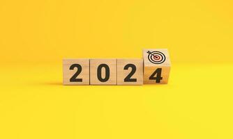 The year 2024 target dart on yellow background. 2024 business planning and strategy concept. investment trends next new year. photo