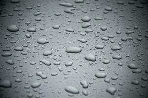 water drops on a metal surface photo