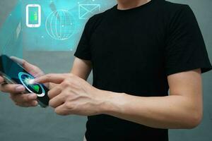 Asian man scanning fingerprints for digital encryption Unlock system will send unlock notification to network signals such as email, phone and ID card before unlocking. photo
