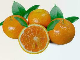 Sliced orange and orange fruit with green leaves isolated on white photo