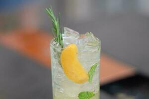 cocktail in the glass with mint and lemon photo