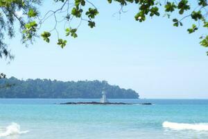 a view of the sea and the beach lighthouse photo