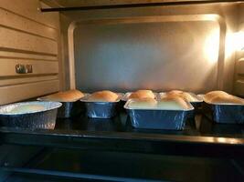 Baking muffins bread  in the oven in the kitchen at home. photo