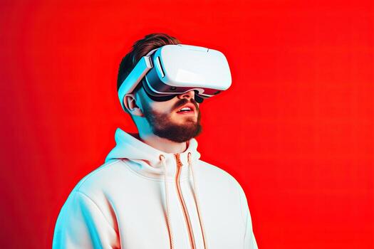 man using virtual reality headset on red background. photo