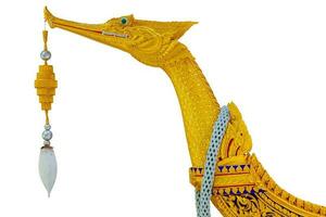 Suphannahong Royal Barge Closeup the boat bow wooden swan carved beautiful golden paint isolated on white background with clipping path. photo