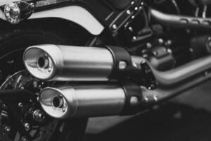 Motorcycle Closeup Customs Exhaust Pipes Big Muffler End Tip Dual Twin Out In Black And White Vintage Tone photo