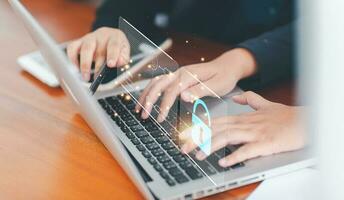 Cybersecurity global network security and technology concept, Businessman use laptop security to manage important documents safely online to protect personal information. photo