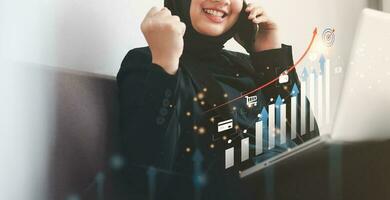Growth and development chart of the company. Digital online marketing investment business planning and development. A smiling businesswoman analyzing growth data graph and Development to success. photo