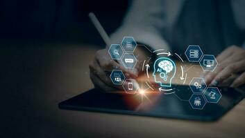 Businessman using tablet chatting intelligent artificial intelligence. Futuristic technology. Chat with AI or Artificial Intelligence technology, Digital chatbot, and robot application. photo