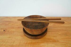 Wooden bowl on the table photo