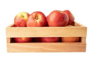 Apples in wooden box isolated on white background with clipping path. photo