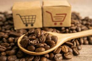 Box with shopping cart logo symbol on coffee beans, Import Export Shopping online or eCommerce delivery service store product shipping, trade, supplier concept. photo