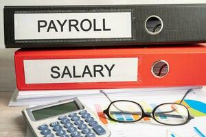 Payroll salary. Binder data finance report business with graph analysis in office. photo