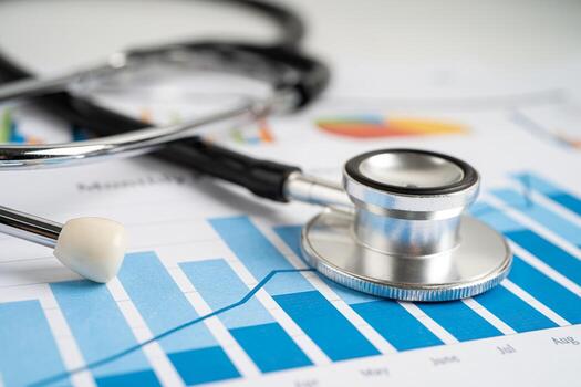 Stethoscope on graph paper, Finance, Account, Statistics, Investment, Analytic research data economy and Business company concept. photo