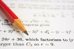 Pencil on mathematic formula exercise test paper in education school. photo