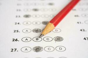 Answer sheets with pencil drawing fill to select choice, education concept. photo