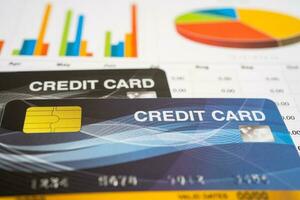 Credit card model on graph spreadsheet paper. Finance development, Banking Account, Statistics, Investment Analytic research data economy, Stock exchange trading, Business company concept. photo