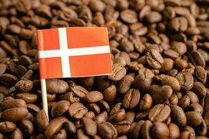 Denmark flag on coffee bean, import export trade online commerce concept. photo