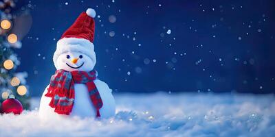 The snowman with red hat and scarf is standing in the snow,. photo