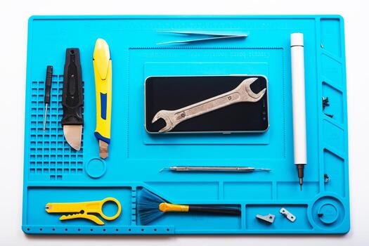 Flat lay image of dismantling the broken smart phone for preparing to repair or replace some components, Top view photo