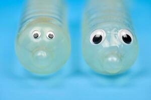 Two funny condom with eyes photo