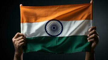 Hand holding India flag photo