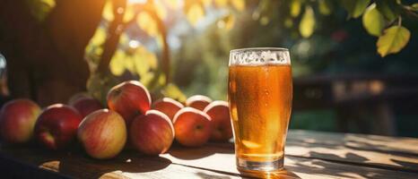 Apple cider on table with apples photo