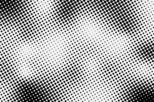 Abstract spotted halftone black effect. Monochrome texture for printing on badges, posters, and business cards. Vintage background of dots randomly arranged vector