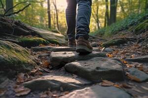 Close up a person's feet walking on rocks, Walking on a trail in the woods, Travel Concept. photo