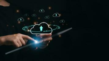 Hand holding smartphone and laptop with cloud computing diagram show on hand. Cloud technology. Data storage. Networking and internet service concept, Cloud sharing download and upload photo
