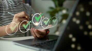 Businesswomen do online checklist surveys, Checkmarks on checklists, and fill out online forms or answer questions. Business performance checklist, evaluation, online survey, and online exams. photo