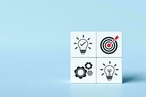 Idea icons, goals and gears on cube. Concept of process Plan business strategies and action plans. and problem-solving or creative management. photo