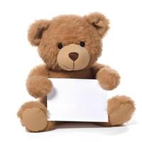 Brown Teddy Bear sitting on a White Background with a Blank Piece photo