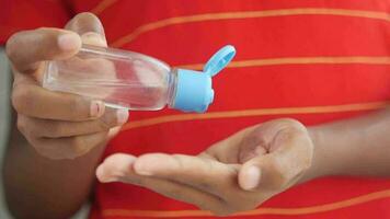 a person using hand sanitizer to prevent virus spread video
