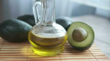 avocado oil in a glass bottle on a wooden table video