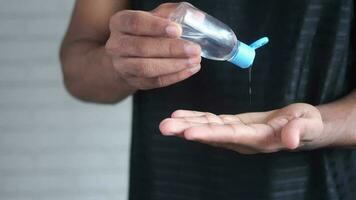 Using hand sanitizer to prevent virus spread video