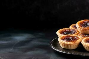 Delicious Butter Tarts dark background with empty space for text photo