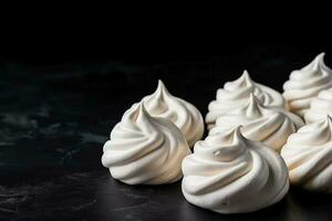 Delicious Meringues with Double Cream dark background with empty space for text photo