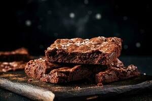 Delicious brownies dark background with empty space for text photo